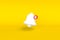 Minimal notification bell with new notification on yellow background. 3D rendering