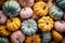 Minimal pastel Thanksgiving pumpkins background, web banner. Many trendy modern pastel pumpkins on table. Autumn holidays pastel