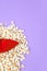 Minimal popcorn background and fashion lady shoes. Still life vertical design.  Diet, fast food, calory concept