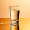 Minimal Retouching: Glass Of Water On Orange Table