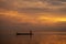 Minimal silhouette fisherman on the lake with twilight sky