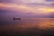 Minimal silhouette fisherman on the lake with twilight sky
