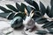 Minimal style Easter eggs, bunny rabbit, eucalyptus leaves on marble table. Generative ai