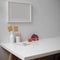 Minimal worktable with stationery, notepad, decorations and copy space on white desk