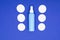 Minimalism concept. bottles for cosmetics and cotton pads on a blue background with copy space