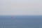 Minimalism human scale of lonely kite surfing at sea