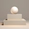 Minimalist 3d Ball On White Sphere With Stacked Objects