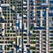 A minimalist aerial view of a bustling cityscape, with abstract patterns formed by the arrangement of buildings3, Generative AI
