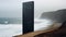 Minimalist Black Tower: A Monumental Sculpture On The Ocean\\\'s Edge