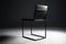 minimalist chair with sleek lines and padded seat
