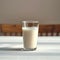 Minimalist charm Glass of milk on a white table