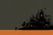 Minimalist composition of a background for halloween, grey and orange background with silhouette of a spooky castle and