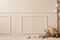 Minimalist composition of children room interior with copy space, wicker baskets, wooden blockers, animal plush toys, ladder,