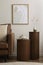 Minimalist composition of elegant and warm space with brown sofa, wooden side tables, mock up poster frames, decoration and