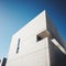 Minimalist Concrete Building Facade Against Clear Blue Sky