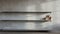 Minimalist Editorial Photograph Of A Polished Shelf In A Concrete Wall