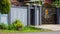 Minimalist fence in front of residents\' houses on the roadside.