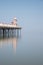 Minimalist fine art image of colorful old pier in foggy morning