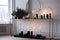 a minimalist fireplace, with a few candles and ornaments for decoration