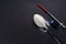 Minimalist flat lay composition sugar, spoon, syringe and vials on the dark background. Medical, Healthcare and Diabetes Concept.