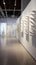 A minimalist gallery with a 3D white ripple wall pattern,