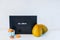 Minimalist Halloween decor - letter board with Helloween message, decorative pumpkins and cup with sweet macaroons on