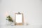 Minimalist home decor with empty frame mock-up on white wall background