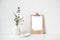 Minimalist home decor with empty frame mock-up on white wall background