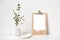 Minimalist home decor with empty frame mock-up on white wall background