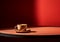 Minimalist image of red table with a cup of coffee on dark red background