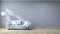 Minimalist interior design,light gray sofa with lamp on gray wall and hardwood flooring