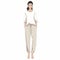 Minimalist Japanese Design: Woman In Sweat Pants And White Blouse