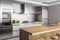minimalist kitchen with sleek stainless steel appliances, wooden countertops, and minimalist decor