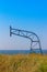 The minimalist landscape of the old backboard for a basketball ring at an abandoned basketball court in the background of blue sea