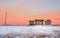 Minimalist landscape. Wooden fish smokehouses in authentic village of Teriberka