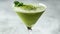 Minimalist Matcha Martini. A pristine matcha martini cocktail graces a sleek martini glass, garnished with a crisp leaf