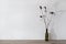 Minimalist neutral branding interior design template, beige wooden tabletop with dried flowers in vase, empty white wall