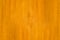 Minimalist orange color wooden board close up view for texture background