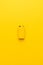 minimalist photo of blank nine-volt battery on yellow background