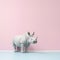 Minimalist Photography Of A Cute Rhinoceros In A Light Pink Room