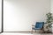 Minimalist room blue chair against white wall creates serene ambiance