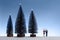 Minimalist scene with miniature fir trees and couple. Copy space