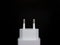 A minimalist shot of Square and white head charger in black background
