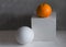 Minimalist still life concept with grape fruit and white geometric figures