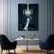 Minimalist style image of person raising champagne glass in beautifully decorated room