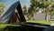 Minimalist triangular house shaped wooden building as homestay, hotel, vacation, camping exotic lodging in the forest
