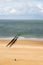 Minimalist view of the Dutch coastline with the water breakers during low tide of the North sea under a dramatic sky