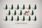 Minimalist Vintage Christmas postcard with plastic Christmas trees and wooden toy deer