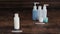 Minimalist vs hoarder lifestyle, one beauty product essential vs group with different types of lotions and moisturizers and camera