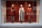 minimalist window display with stylish outfits on mannequins